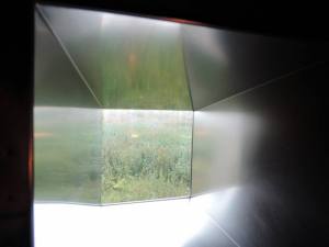 I think it's interesting and symbolic the way the windows in this dark memorial given a tiny hint of the life -- and hope -- to be found in the world outside. — at Steilneset Memorial in Vardø, Norway.